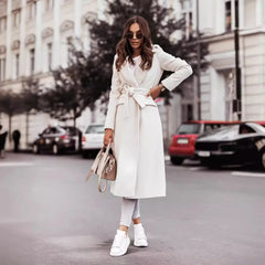 Fashionable women’s wool coat with long sleeves and a belted wrap design. Elegant and versatile — perfect for spring and autumn.