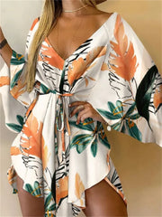 Boho Floral Mini Dress – Sexy V-Neck, Bat Sleeves & Flowy Fit for a Relaxed Summer Look.