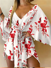 Boho Floral Mini Dress – Sexy V-Neck, Bat Sleeves & Flowy Fit for a Relaxed Summer Look.