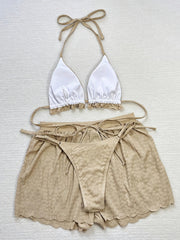 3-piece bikini with ruffles, floral embroidery, and mesh cover-up shorts.