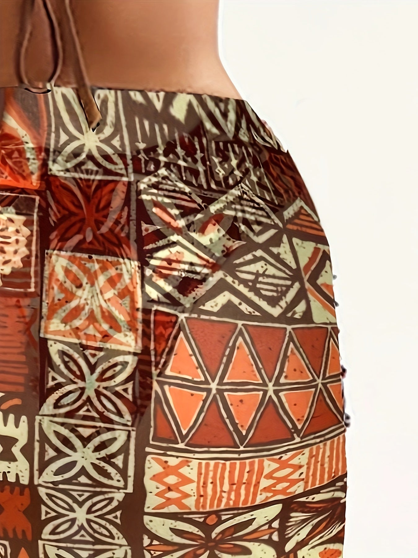 2025 women’s geometric bikini set with halter top, tie detail, and matching headscarf.