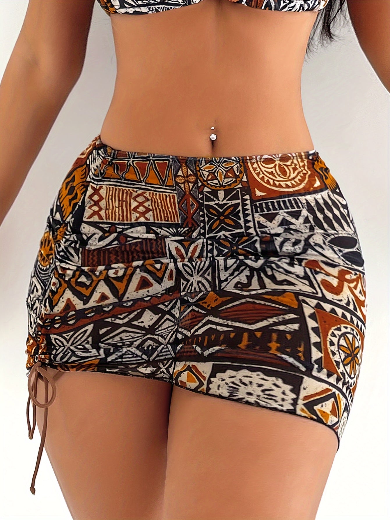 2025 women’s geometric bikini set with halter top, tie detail, and matching headscarf.