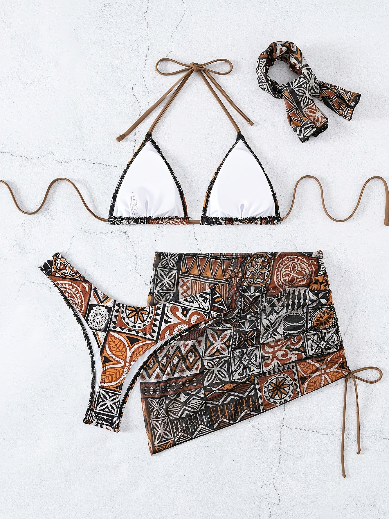 2025 women’s geometric bikini set with halter top, tie detail, and matching headscarf.