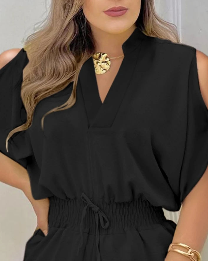 Summer 2025 elegance: cold-shoulder jumpsuit with a high waist.