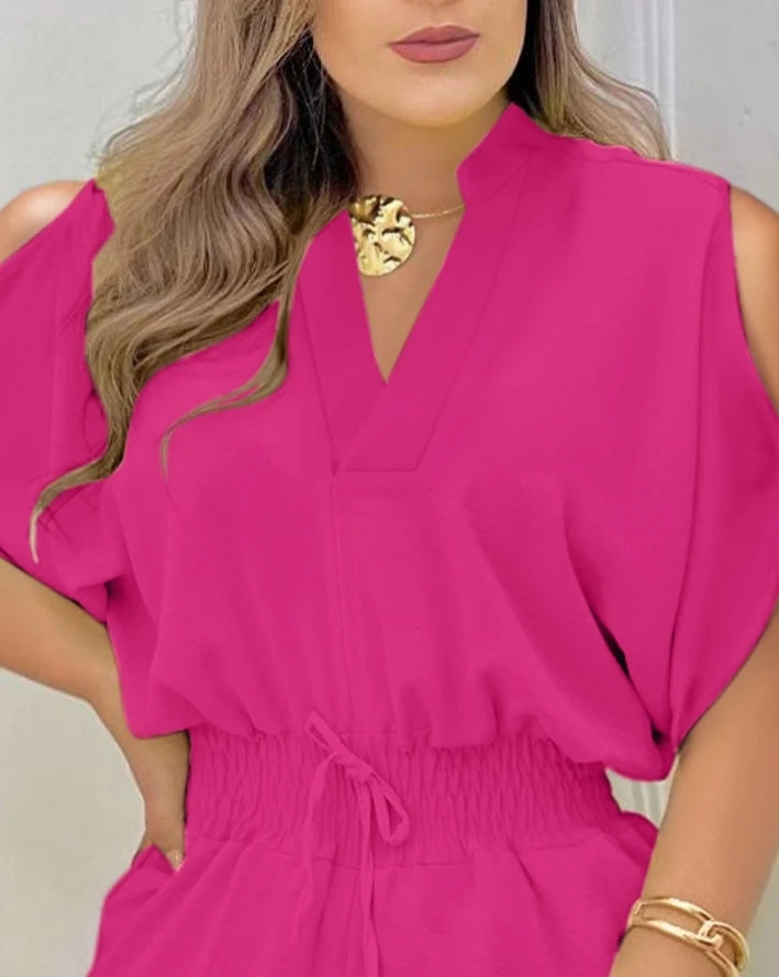 Summer 2025 elegance: cold-shoulder jumpsuit with a high waist.