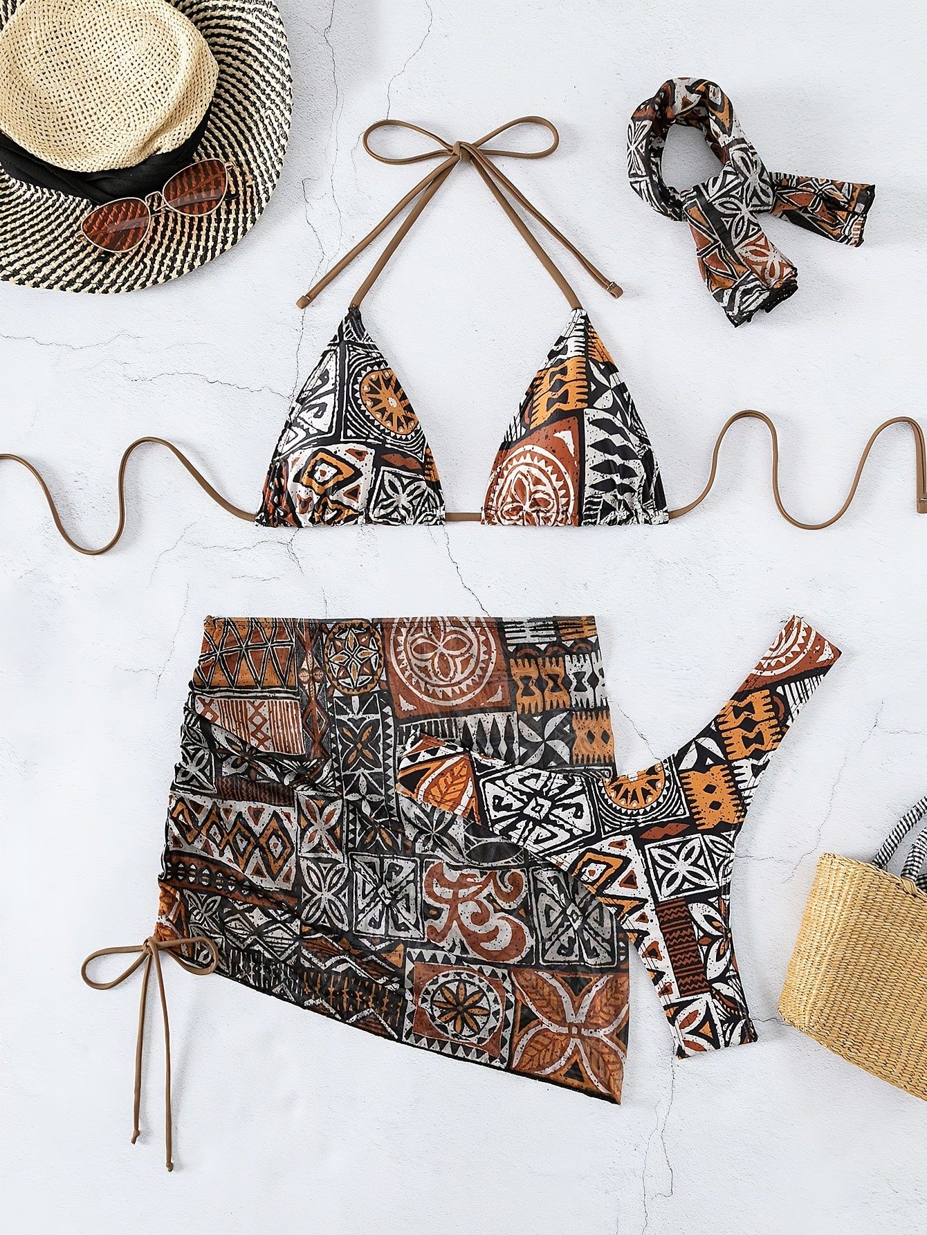 2025 women’s geometric bikini set with halter top, tie detail, and matching headscarf.