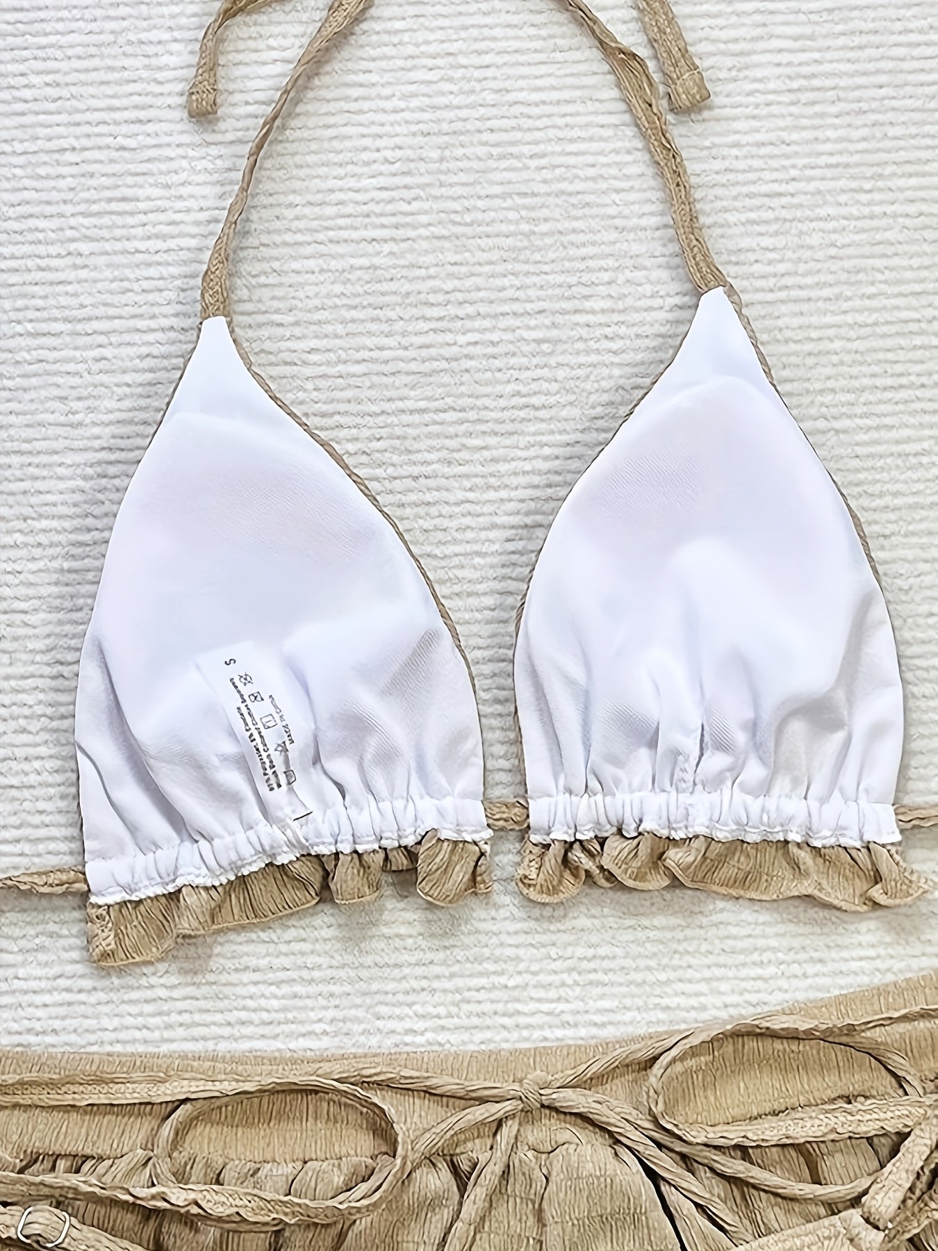 3-piece bikini with ruffles, floral embroidery, and mesh cover-up shorts.