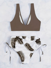 Leaf print color-block bikini set with tie-front top and side-cut bottom.