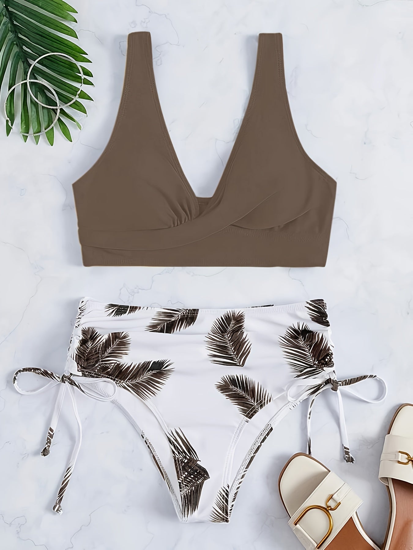 Leaf print color-block bikini set with tie-front top and side-cut bottom.