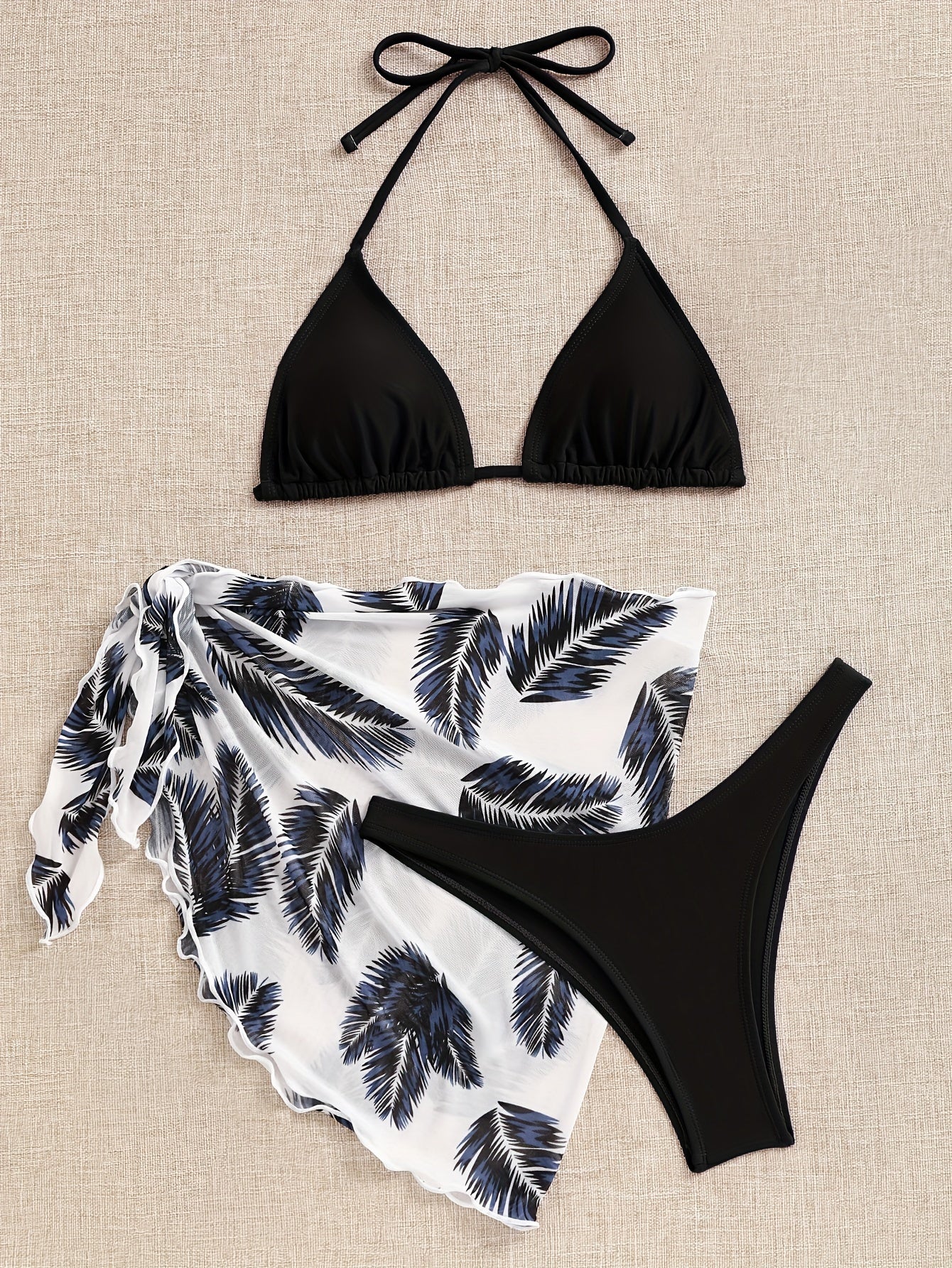 Sexy bikini set with stylish beach cover-up skirt – trendy 3-piece design, perfect for beach vacations and summer days.